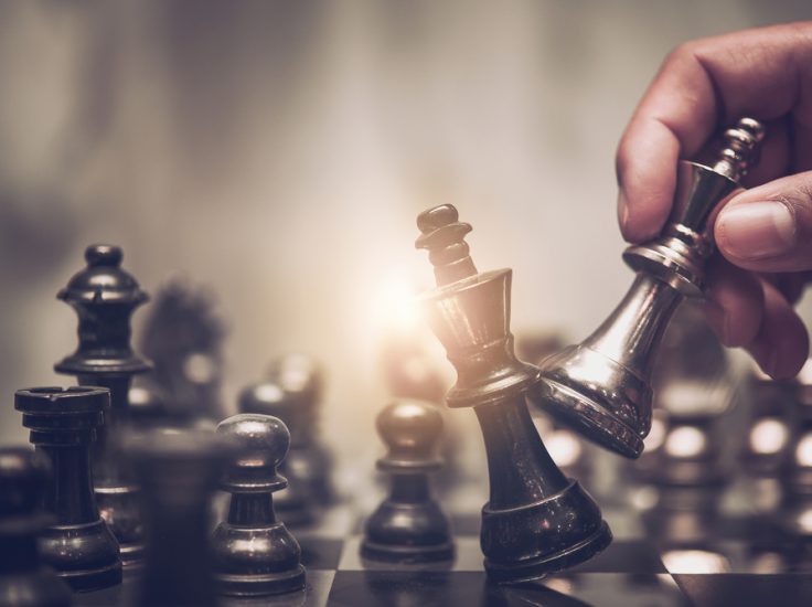 Hand,Of,Businessman,Moving,Chess,Figure,In,Competition,Success,Play.